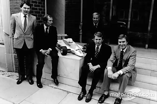 McLaren International John Barnard, Ron Dennis Teddy Mayer behind Tyler Alexander and Creighton Brown pose with a model of the McLaren MP4-1 at Canadian GP 1980