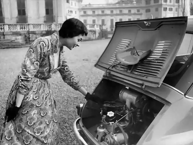 a-model-looking-at-the-engine-of-a-fiat-600-multipla-italy-january-1956