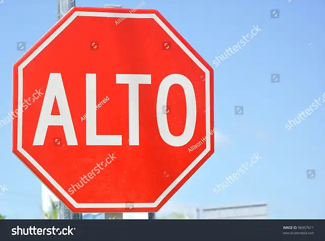 stock-photo-traffic-sign-in-spanish-alto-and-english-english-96957611