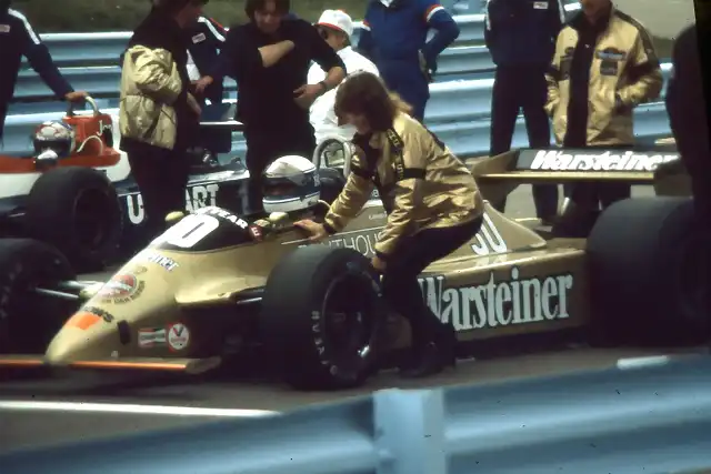 Jochen Mass being attended to by one of the Penthouse girls on the Grid Watkins Glen 1980