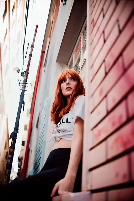 beautiful-woman-blur-brick-wall-building