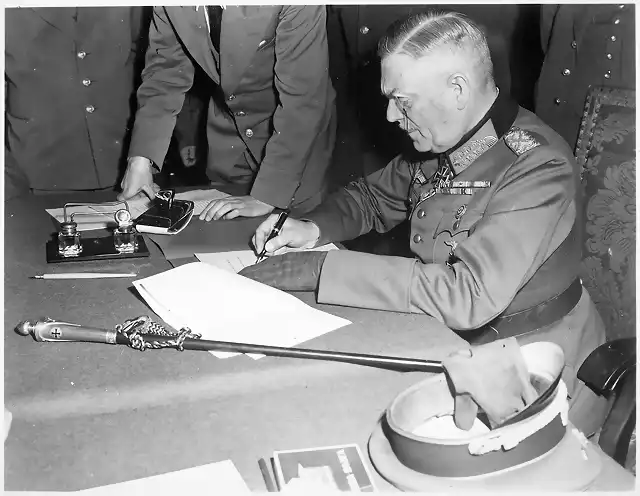 Field_Marshall_Wilhelm_Keitel,_signing_the_ratified_surrender_terms_for_the_German_Army_at_Russian_Headquarters_in..._-_NARA_-_531290.tif