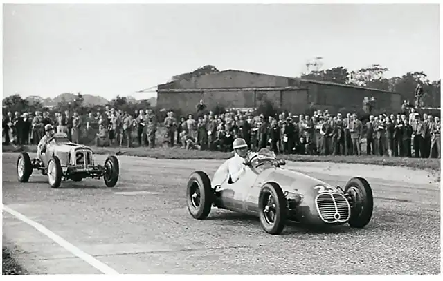 The first 12-mile Goodwood Tropy race for 1500cc racing cars was a spectacular event. Here Reg Parnell's Maserati 4CLT leads Bob Gerard's pre-war ERA