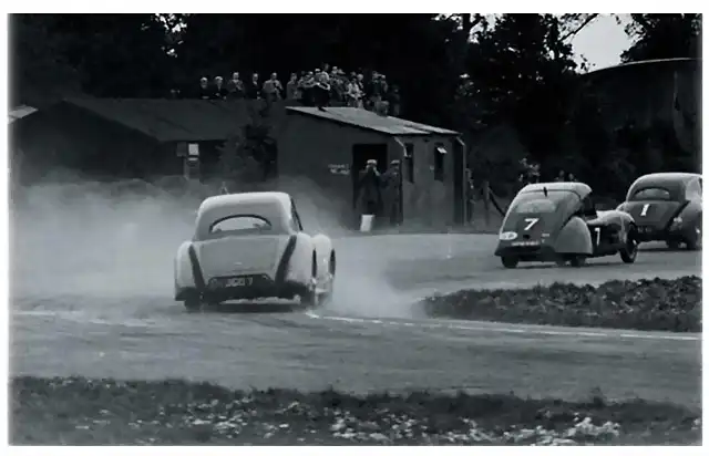 Woodcote Corner 1948 the field chases the eventual winner of Goodwood's first race Paul Pycroft