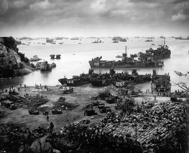 April 13. 1945 About 350 miles from the Japanese mainland, U.S. invasion forces establish a beachhead on Okinawa island. Pouring out war supplies and military equipment, the landing crafts fill the sea to the