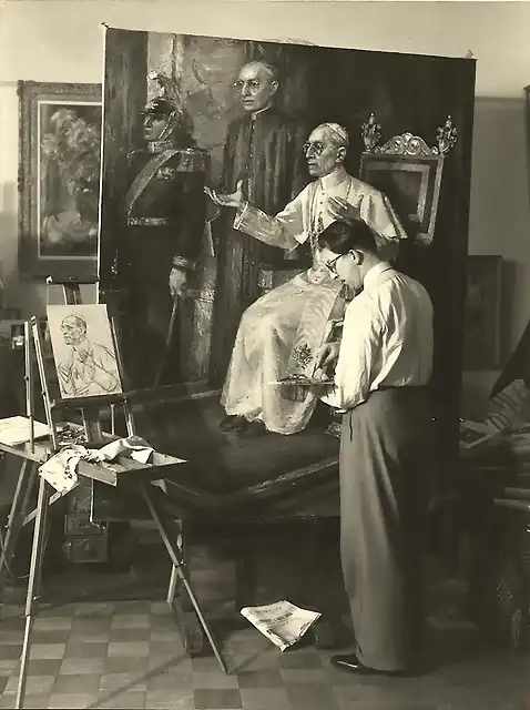 Dutch painter Wim van de Plas working on a portrait of Pope Pius XII in 1950.