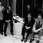 McLaren International John Barnard, Ron Dennis Teddy Mayer behind Tyler Alexander and Creighton Brown pose with a model of the McLaren MP4-1 at Canadian GP 1980