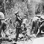 British troops firing a mortar on the Mawchi road. July 1944,