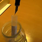 caja plumas y bote cristal tinta 021