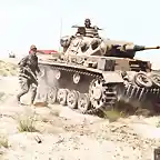 1200px-A_Panzer_III_Ausf._G_of_the_21st_Panzer_Division,_Afrika_Korps_accompanies_the_advancing_infantry_in_Egypt,_May_1942._(49275625756)