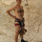 naked mountain climber and dog