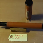 plumas de ebonita naranja 009