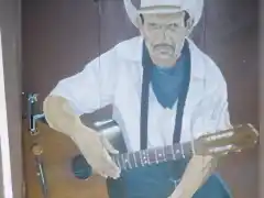 Guitarrista Jinotegano (Pintura de Ilich en las puertas del Hotel de Montaa Selva Negra)