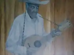 Anciano Guitarrista (Pintura de Ilich en las puertas del Hotel de Montaa Selva Negra)