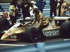 Jochen Mass being attended to by one of the Penthouse girls on the Grid Watkins Glen 1980