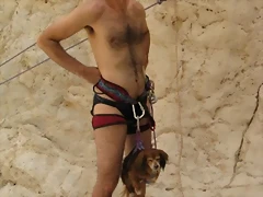 naked mountain climber and dog