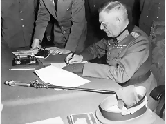 Field_Marshall_Wilhelm_Keitel,_signing_the_ratified_surrender_terms_for_the_German_Army_at_Russian_Headquarters_in..._-_NARA_-_531290.tif