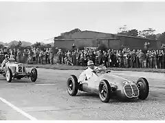 The first 12-mile Goodwood Tropy race for 1500cc racing cars was a spectacular event. Here Reg Parnell's Maserati 4CLT leads Bob Gerard's pre-war ERA