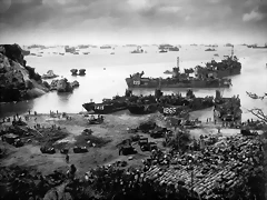 April 13. 1945 About 350 miles from the Japanese mainland, U.S. invasion forces establish a beachhead on Okinawa island. Pouring out war supplies and military equipment, the landing crafts fill the sea to the