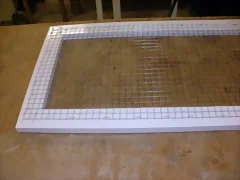 Malla grapada al marco